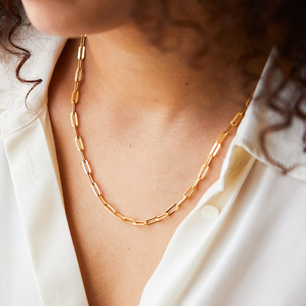 Women's stainless steel chain necklace with sleek gold finish, featuring interlocking links for a modern and elegant look.